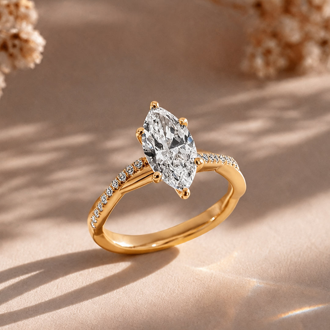 1.5 carat marquise lab grown diamond engagement ring shown at an angle on a styled display at AJ's Jewelry in Ridgewood, Queens NY