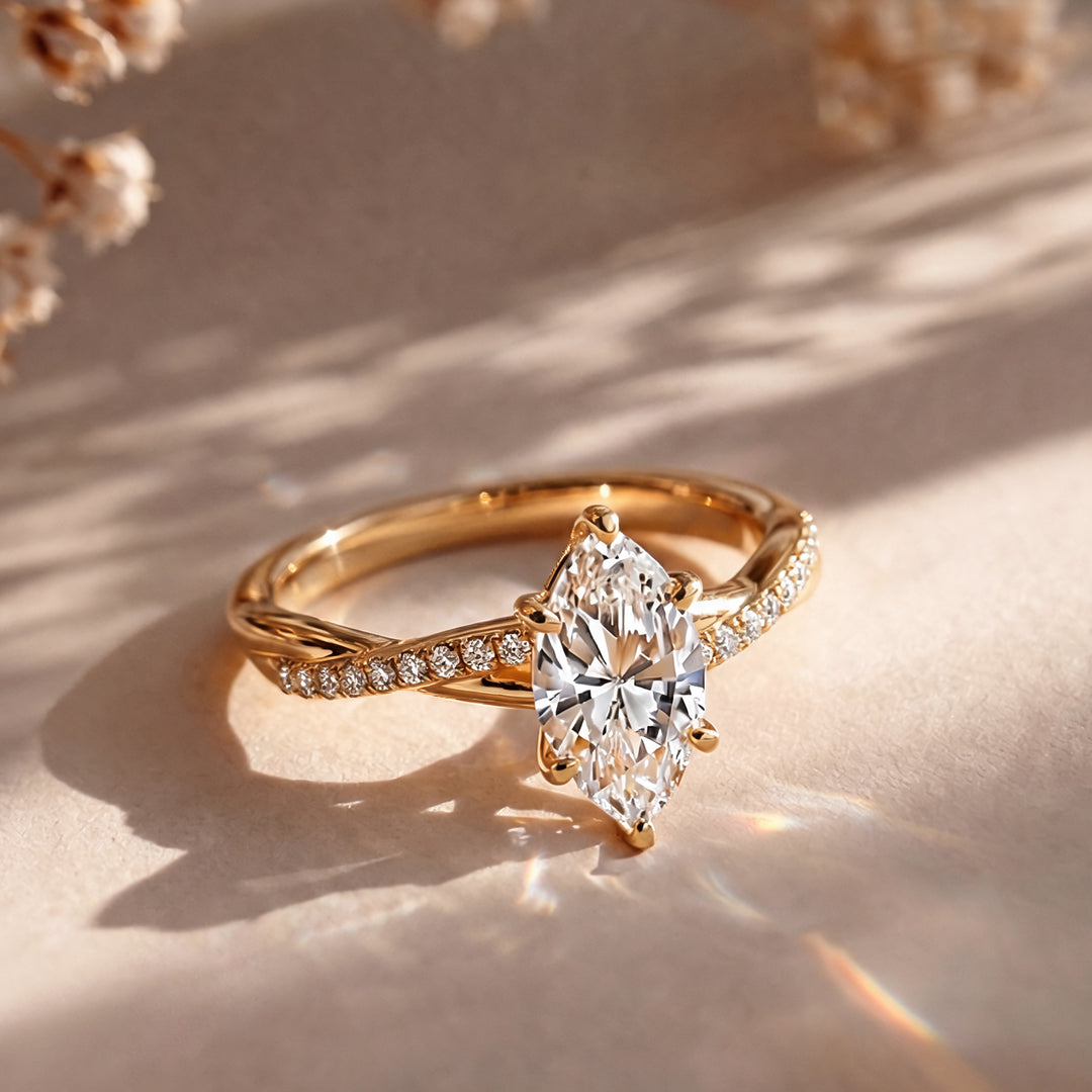 1.5 carat marquise lab grown diamond engagement ring shown from the front on a styled display at AJ's Jewelry in Ridgewood, Queens NY