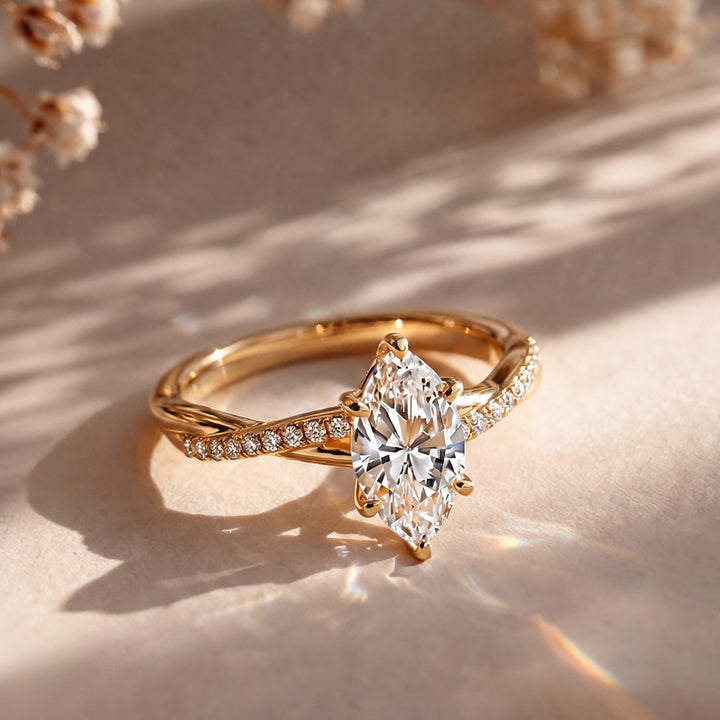 1.5 carat marquise lab grown diamond engagement ring shown from the front on a styled display at AJ's Jewelry in Ridgewood, Queens NY