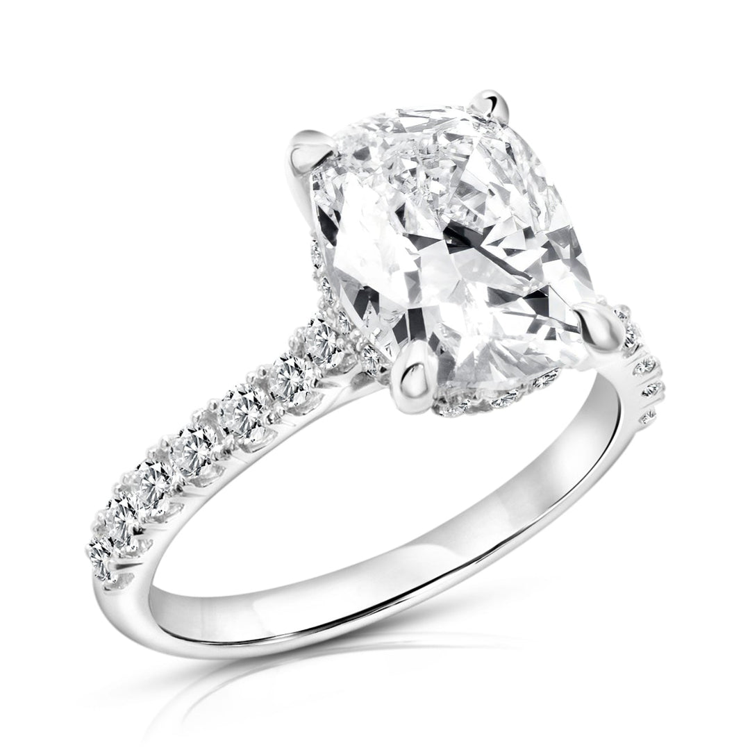 Angled view of the elongated cushion lab grown diamond engagement ring in 14 karat white gold showing the hidden halo beneath the center stone on a pure white background