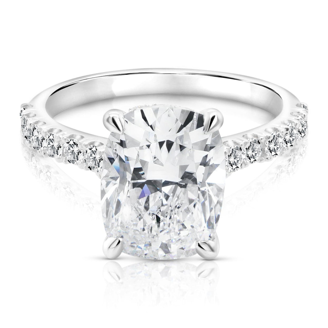 14 karat white gold 3ct elongated cushion lab grown diamond hidden halo engagement ring with diamond accent band, front view