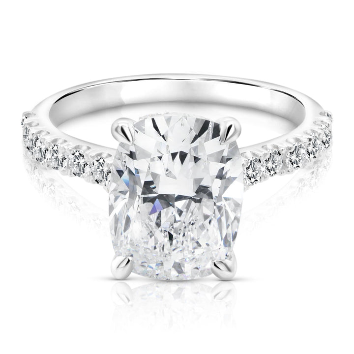14 karat white gold 3ct elongated cushion lab grown diamond hidden halo engagement ring with diamond accent band, front view