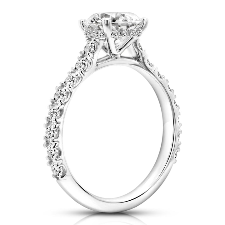 14 karat white gold 3ct round lab grown diamond hidden halo engagement ring with diamond accent band, side profile view