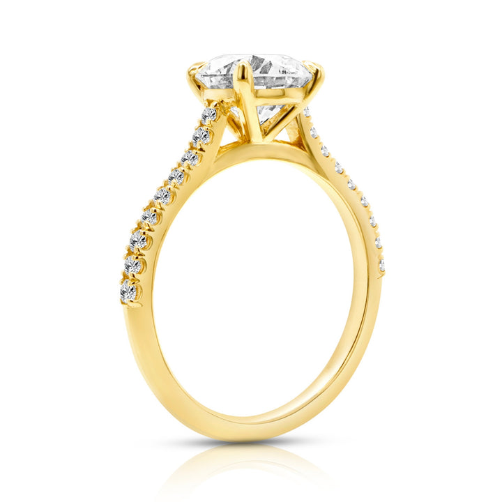 14 karat yellow gold 2ct round lab-grown diamond pavé cathedral engagement ring, side profile view showing the cathedral setting and pavé band