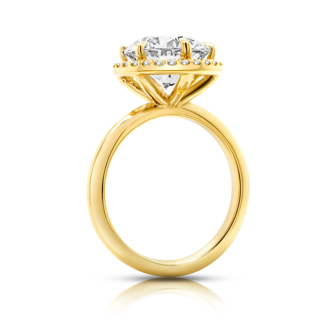 14 karat yellow gold 3ct round lab-grown diamond halo engagement ring, side profile view showing the diamond halo and polished band
