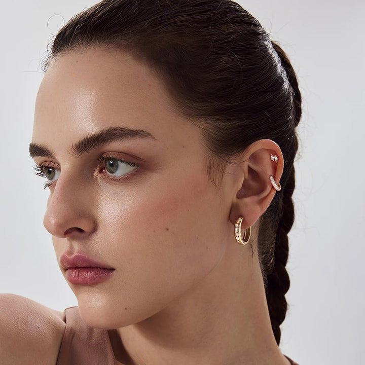 The 14K yellow gold double marquise lab grown diamond stud earrings shown on a model in profile | AJ's Jewelry