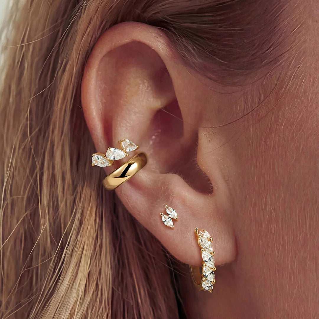 The 14K yellow gold double marquise lab grown diamond stud earrings worn on the ear, side view | AJ's Jewelry