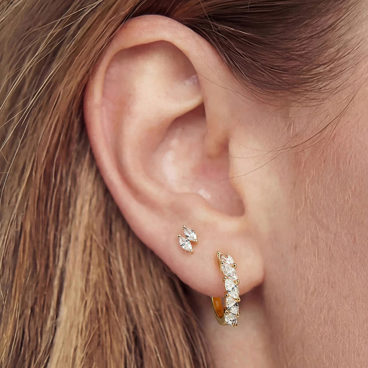 Styled ear look featuring the 14K yellow gold double marquise lab grown diamond stud earrings | AJ's Jewelry