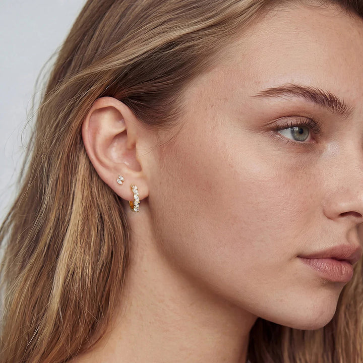 The 14K yellow gold double marquise lab grown diamond stud earrings worn on a model, three-quarter view | AJ's Jewelry