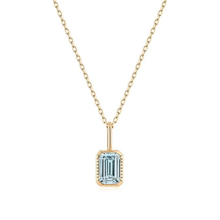 14K yellow gold pendant necklace with a bezel-set emerald-cut lab grown aquamarine