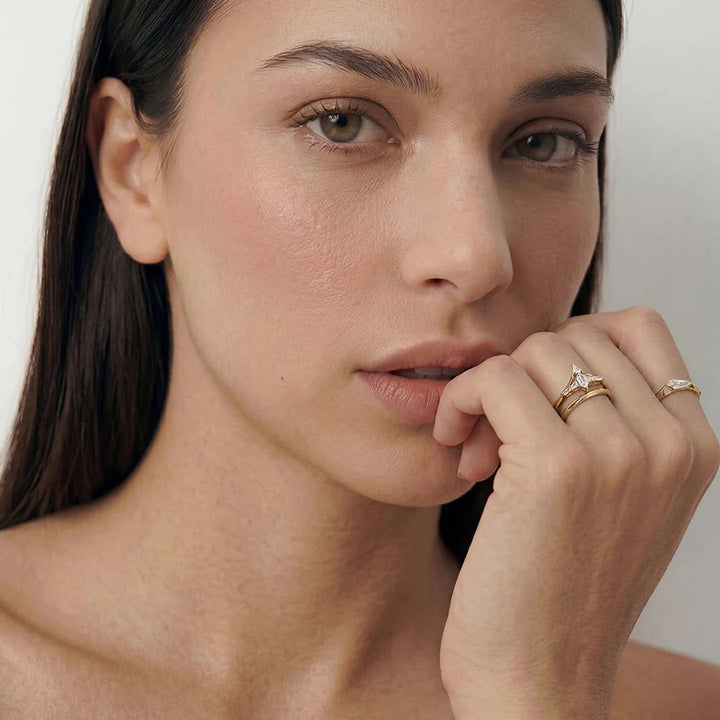 Close-up of the 14K yellow gold fancy-cut lab grown diamond geometric solitaire ring worn on the hand | AJ's Jewelry