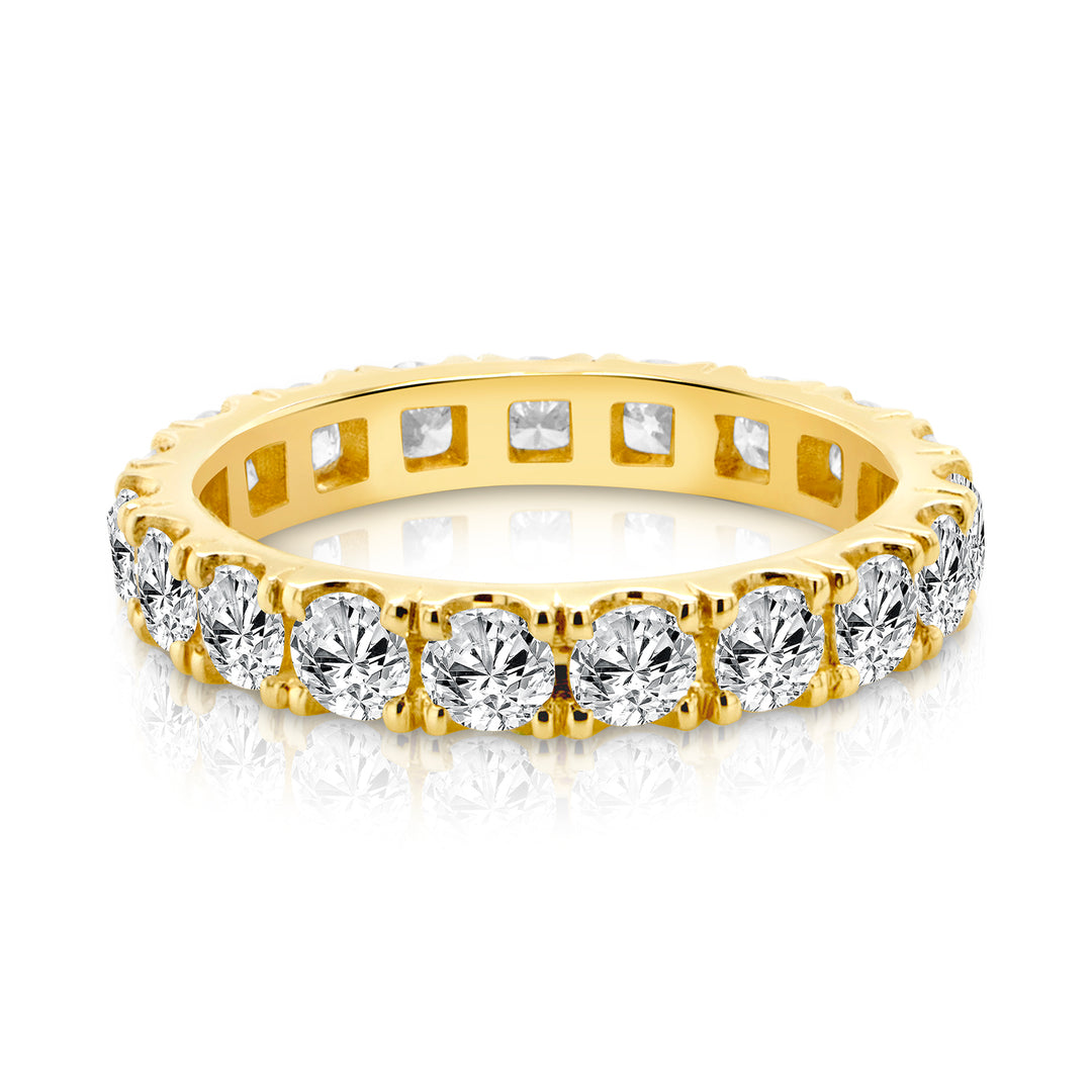 14 karat yellow gold lab grown diamond eternity band, front view of the shared-prong round diamonds