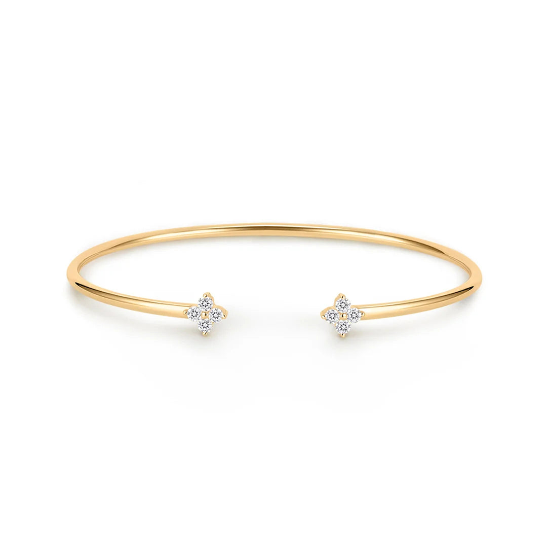 14K yellow gold open cuff bangle bracelet with a four-stone lab grown diamond flower at each end