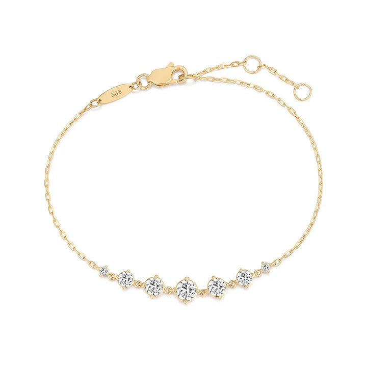 14K yellow gold chain bracelet with a line of seven graduated round lab grown diamonds