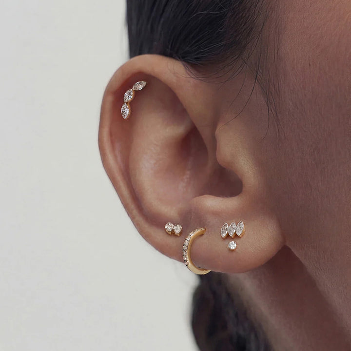 The 14K yellow gold twin marquise lab grown diamond flat back stud earrings shown on a model in profile | AJ's Jewelry