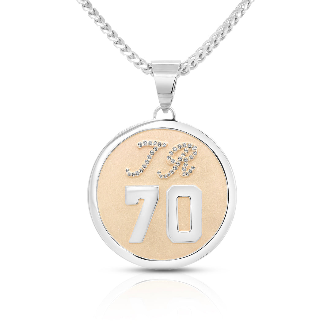 Front view of the 14 karat two-tone diamond initial and number pendant showing the diamond script TR initials above a bold 70 inside a white gold bezel