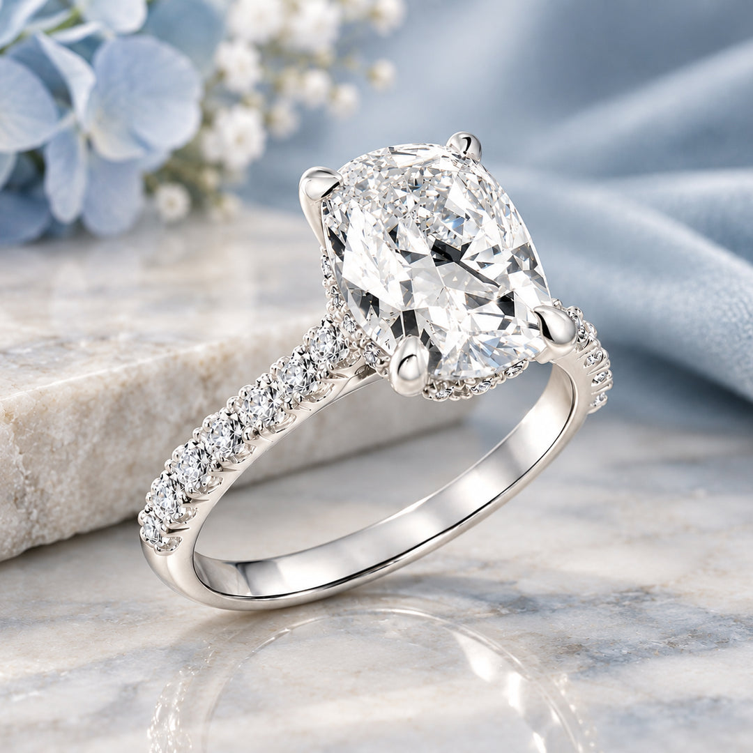 Angled view of the elongated cushion lab grown diamond engagement ring in 14 karat white gold showing the hidden halo beneath the center stone