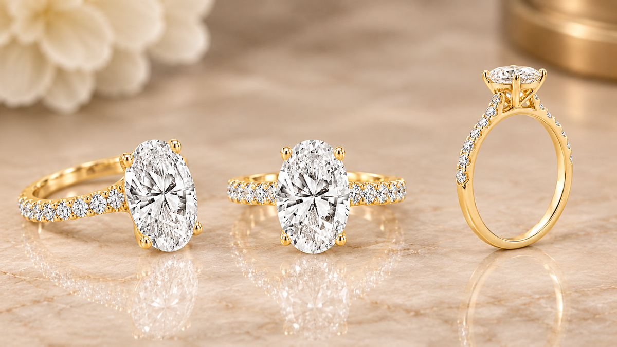 Three views of the 14 karat yellow gold 2ct oval lab grown diamond engagement ring on marble at AJ's Jewelry in Queens NY