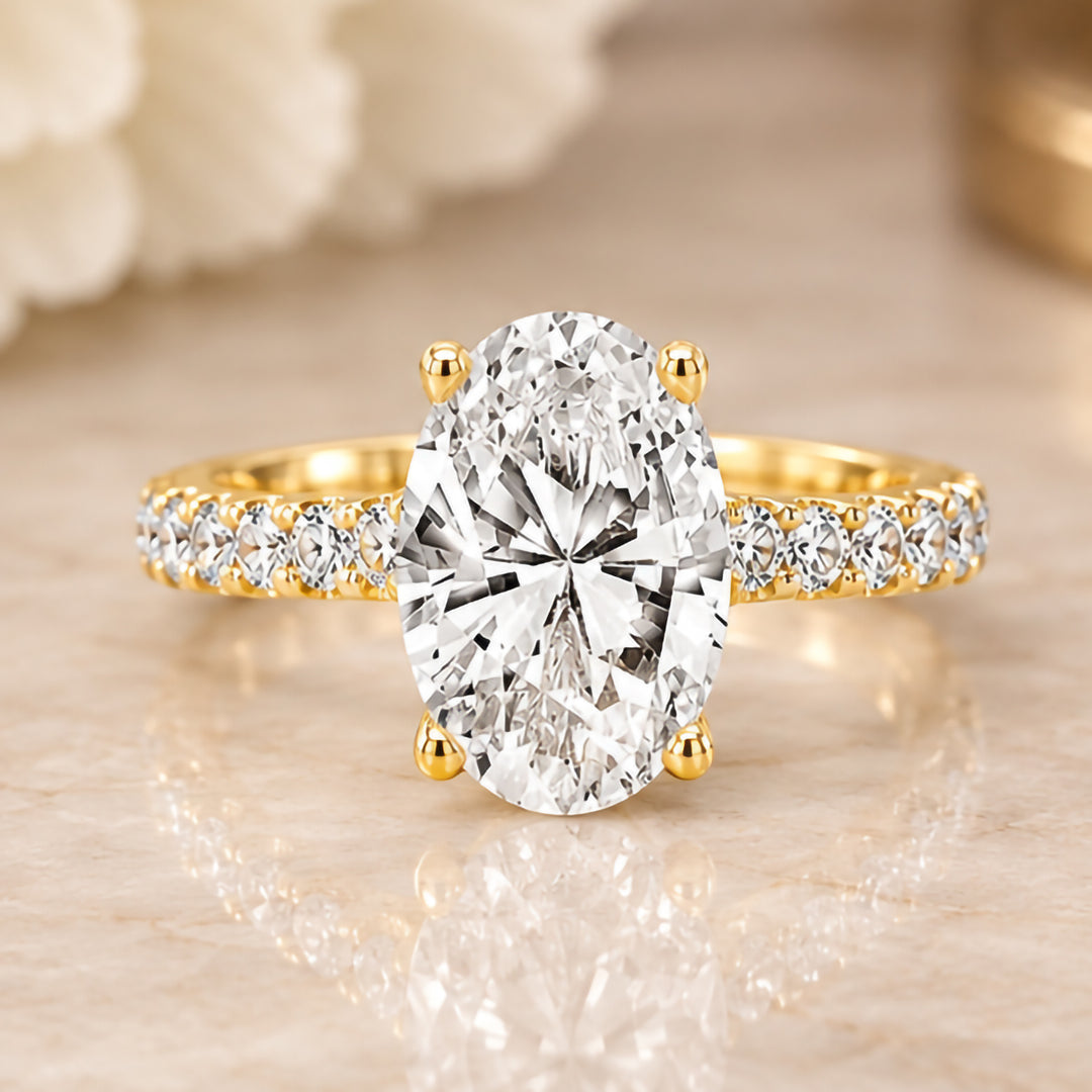 Front view of the 14 karat yellow gold 2ct oval lab grown diamond engagement ring showing the elongated oval brilliant face up