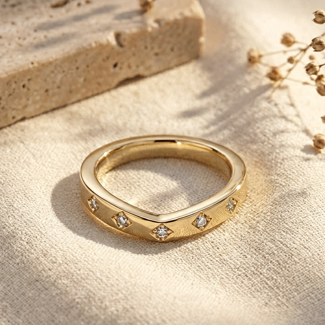 14k yellow gold lab grown diamond chevron wedding band, front view on a styled display - AJ's Jewelry Queens NY