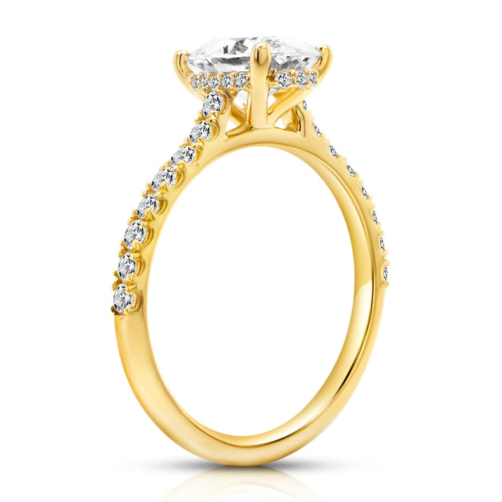 18 karat yellow gold 2ct oval lab grown diamond hidden halo engagement ring with diamond accent band, side profile view