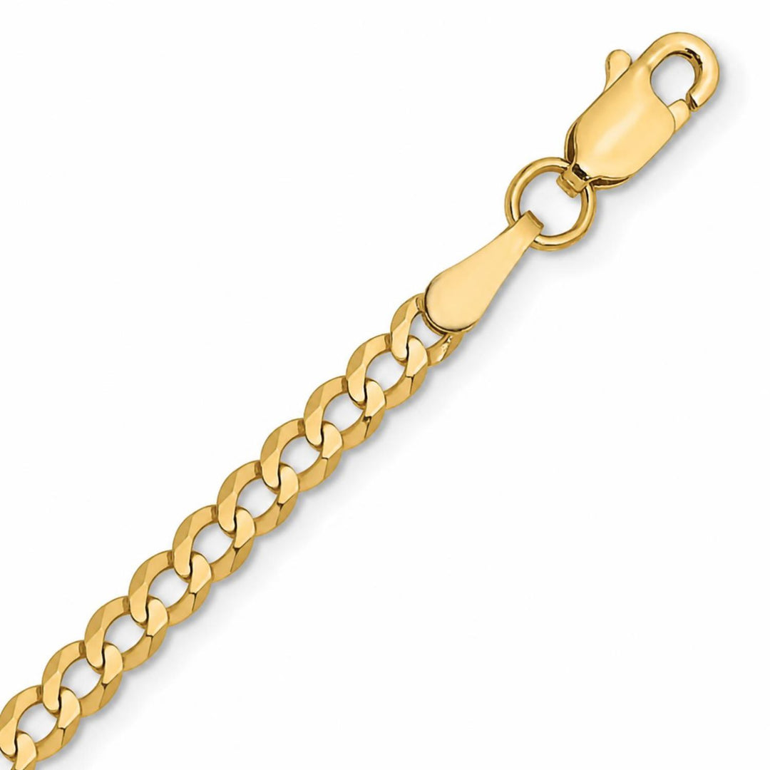 A yellow gold curb chain on a pure white background