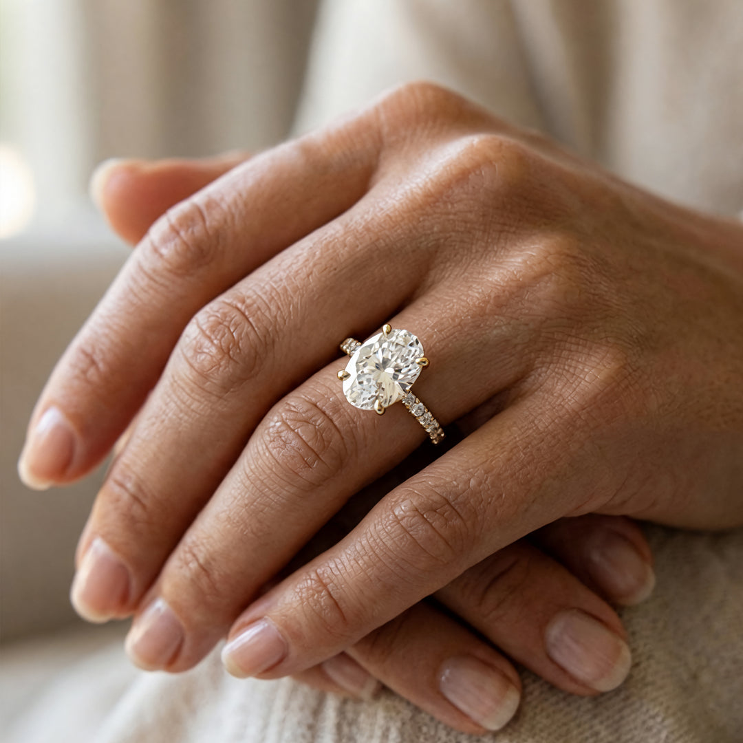 2 carat oval lab grown diamond pave engagement ring worn on a hand at AJ's Jewelry in Ridgewood, Queens NY
