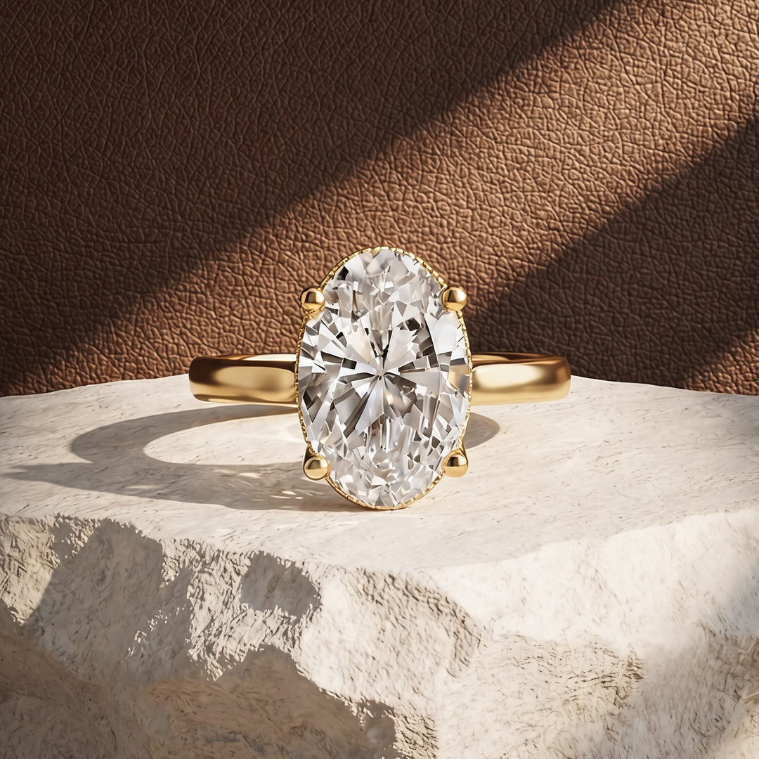 2 carat oval lab grown diamond solitaire engagement ring shown from the front on a styled display at AJ's Jewelry in Ridgewood, Queens NY