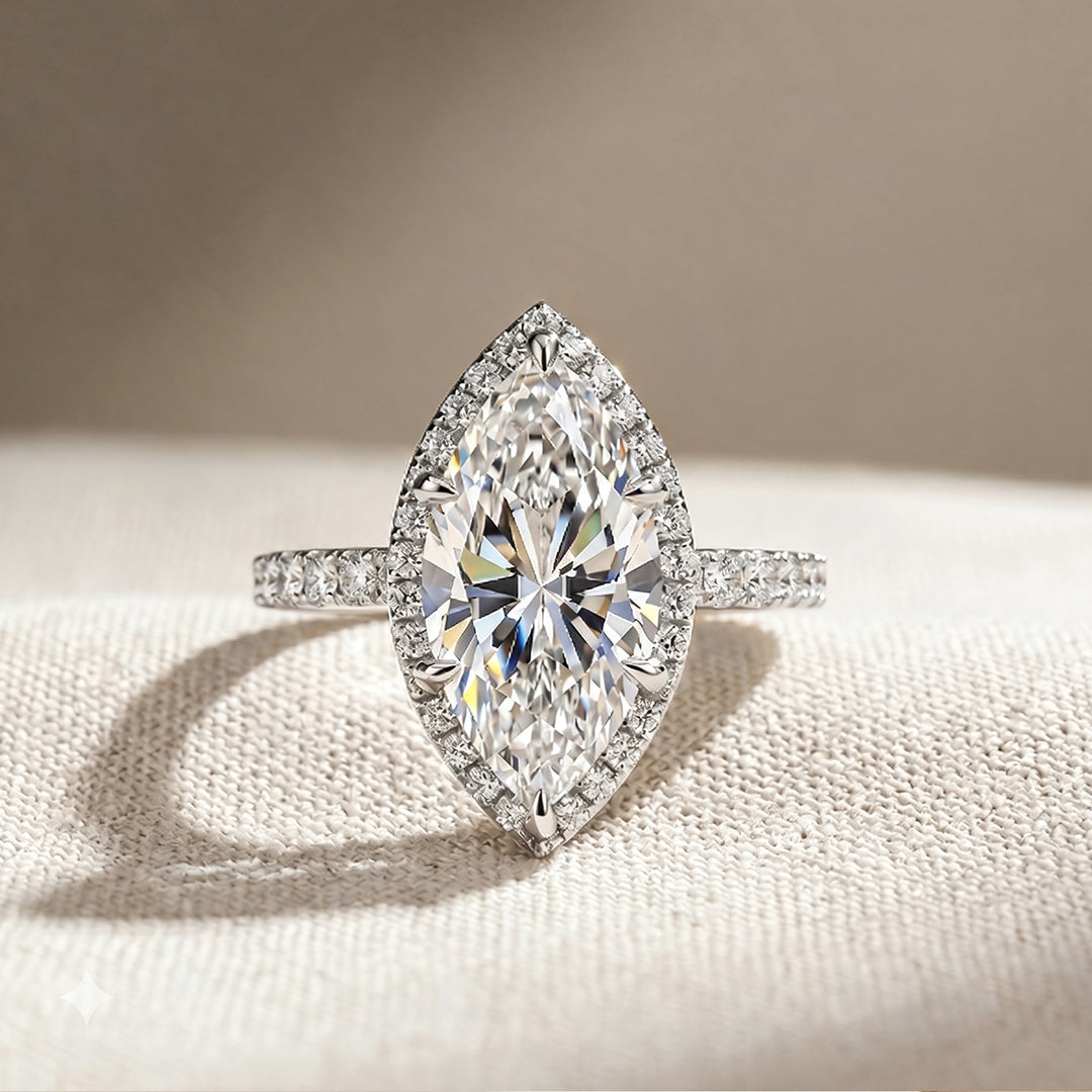Custom 3 carat marquise lab-grown diamond halo engagement ring shown from the front on a styled display at AJ's Jewelry in Ridgewood, Queens NY