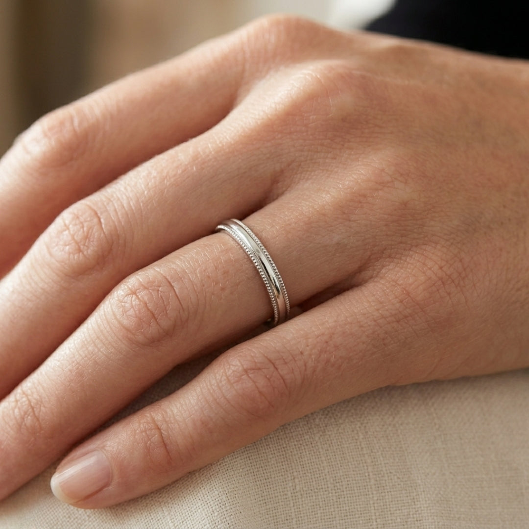 A model wearing the 3mm White Gold Comfort Fit Milgrain Wedding Band