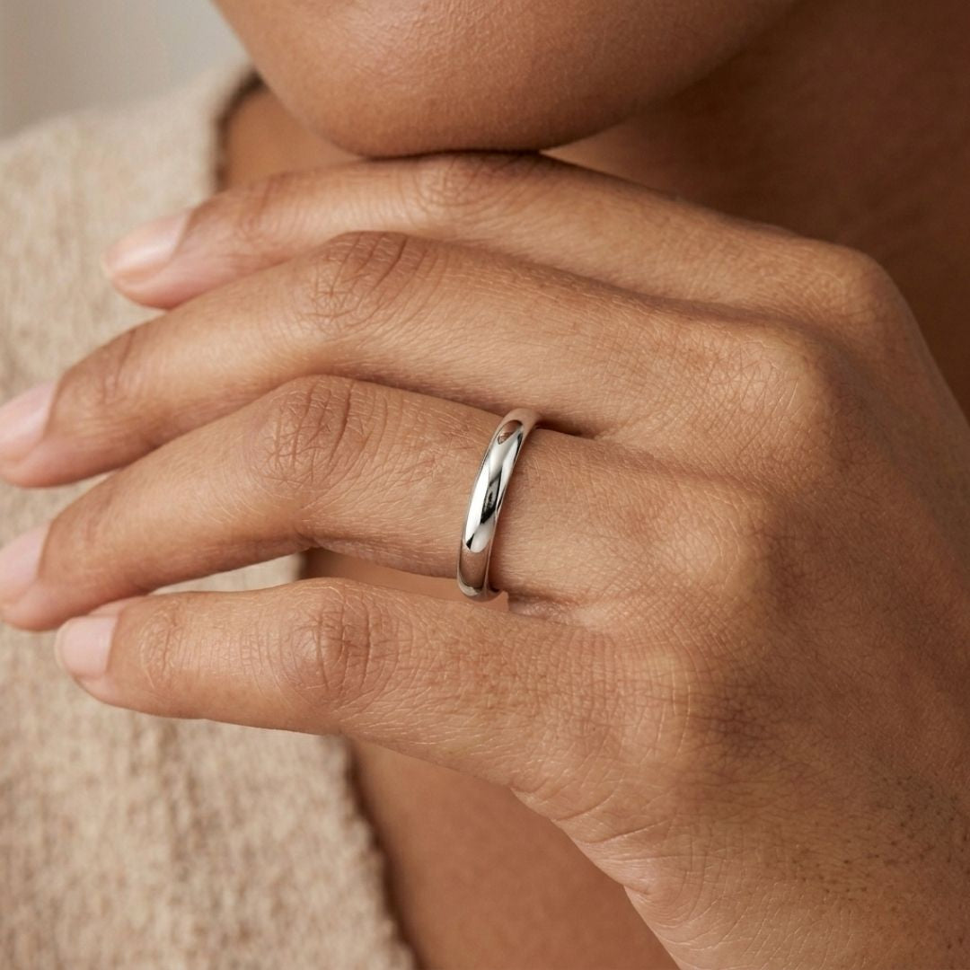 A model wearing the 3mm Slim Half Round Wedding Band in White Gold