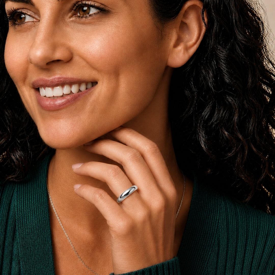 4mm 14K white gold comfort fit wedding band worn on a model's hand, close-up view - AJ's Jewelry, Ridgewood NY