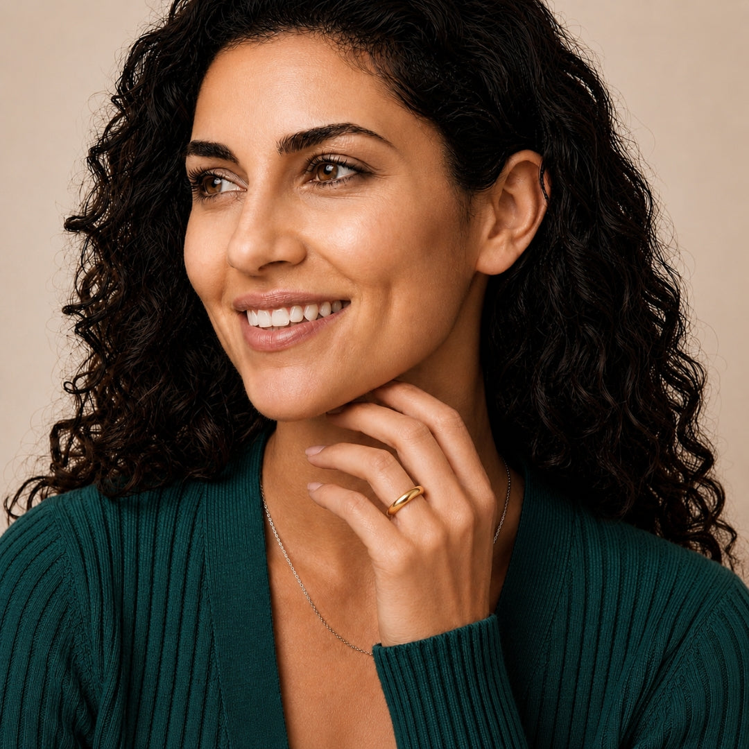 Model wearing a 4mm 14K yellow gold comfort fit wedding band - AJ's Jewelry, Ridgewood NY
