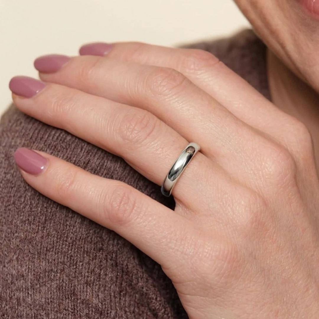 A model wearing the 4mm Slim Half Round Wedding Band in White Gold