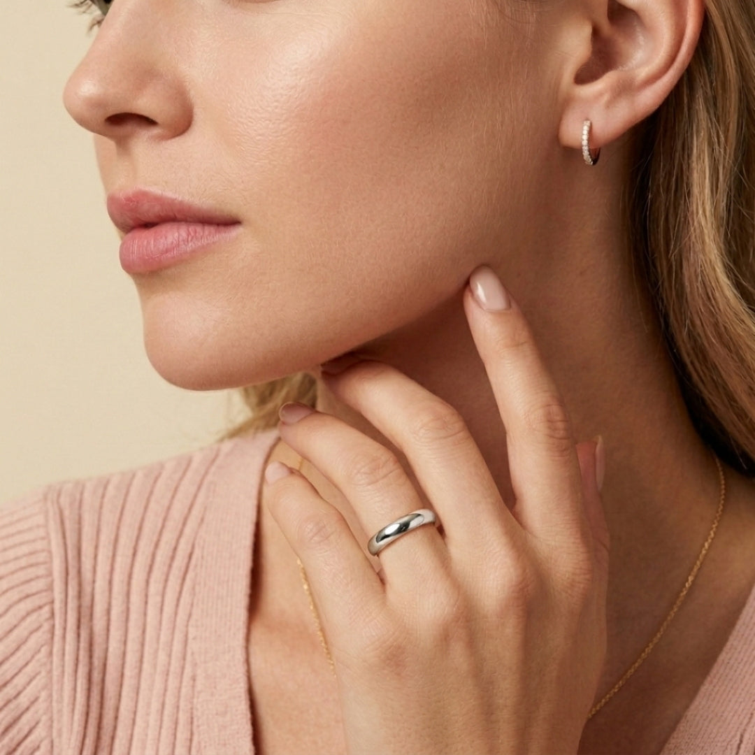 5mm 14K white gold comfort fit wedding band worn on a model's hand, close-up view - AJ's Jewelry, Ridgewood NY