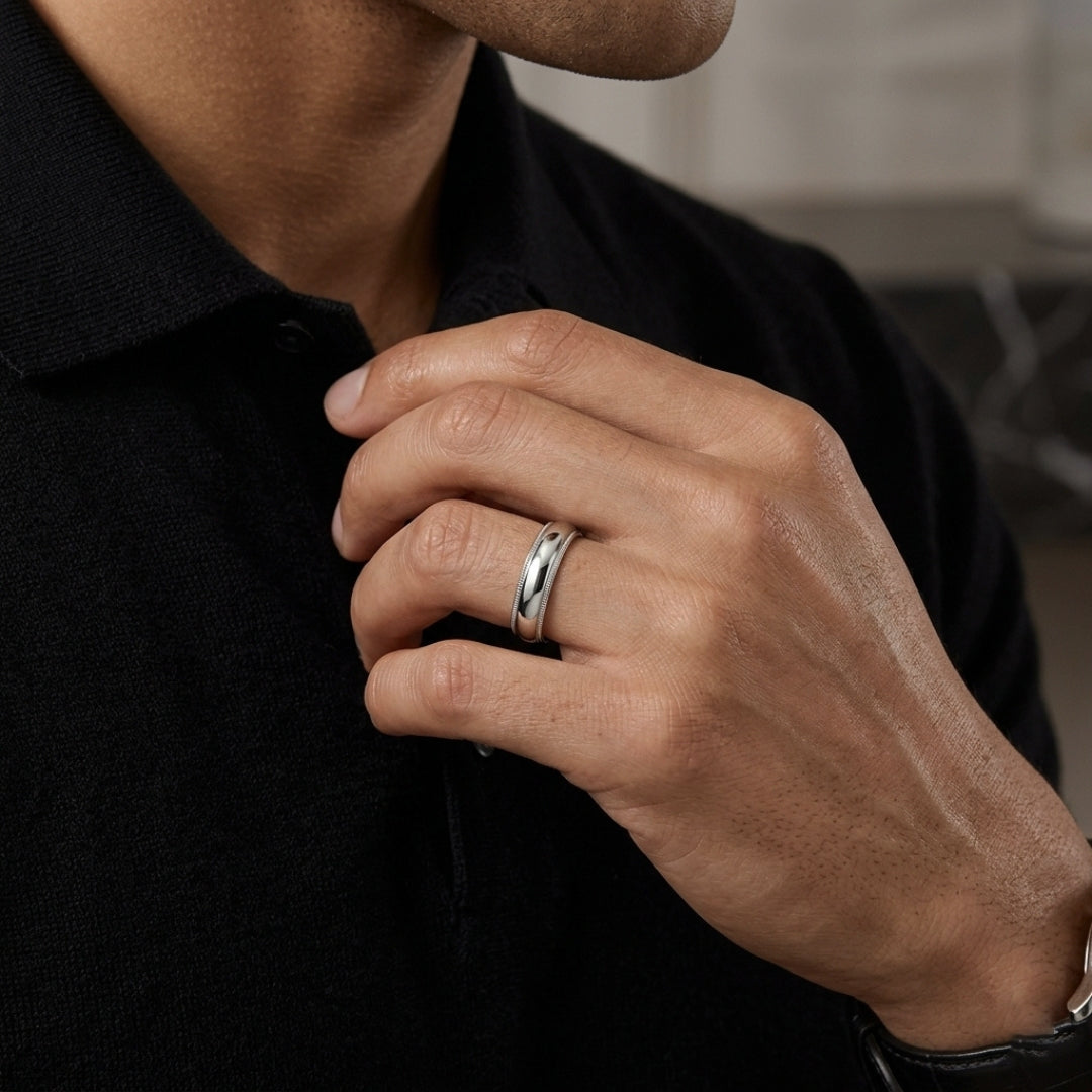 A model wearing the 5mm White Gold Comfort Fit Milgrain Wedding Band
