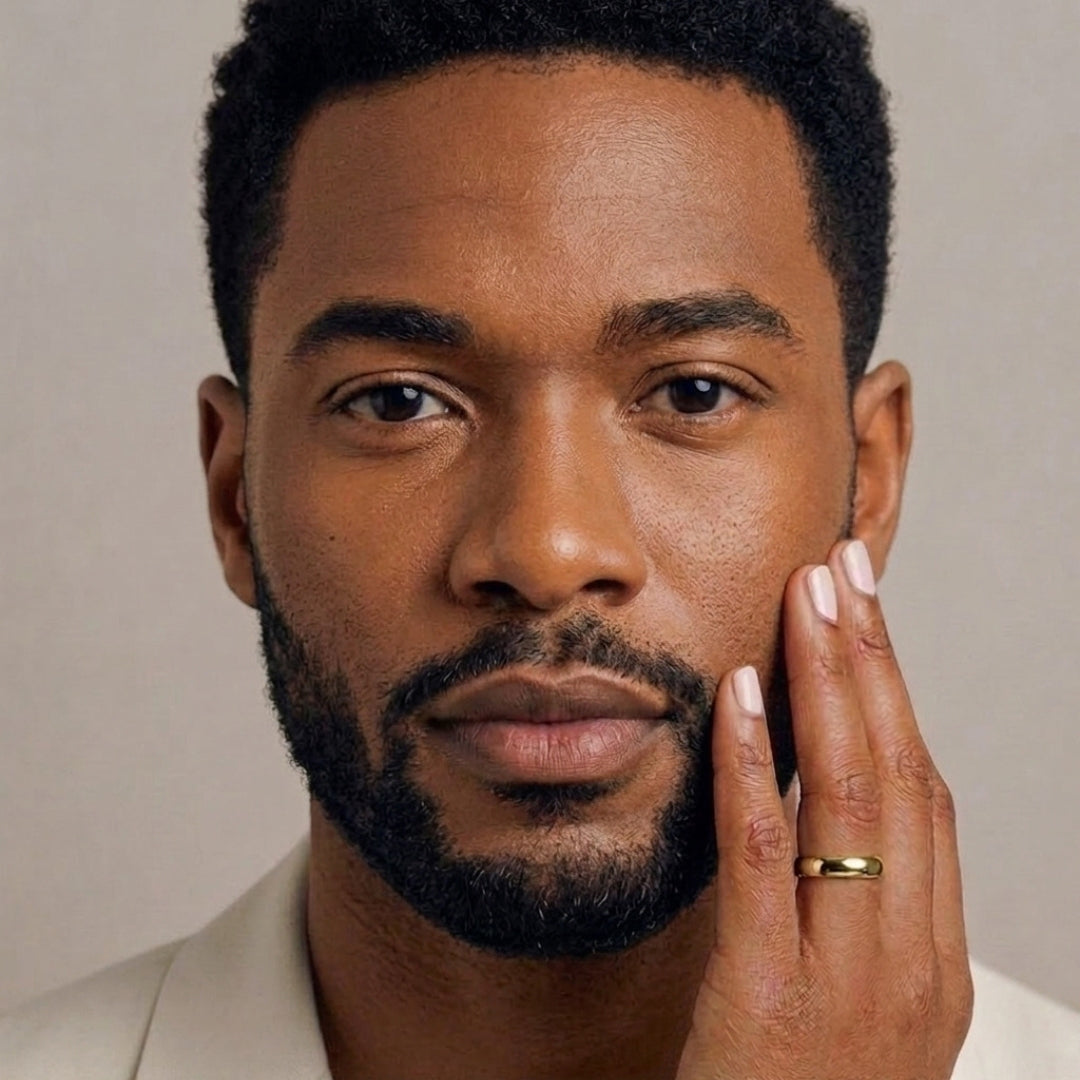 A model wearing the 5mm Slim Half Round Wedding Band in Yellow Gold