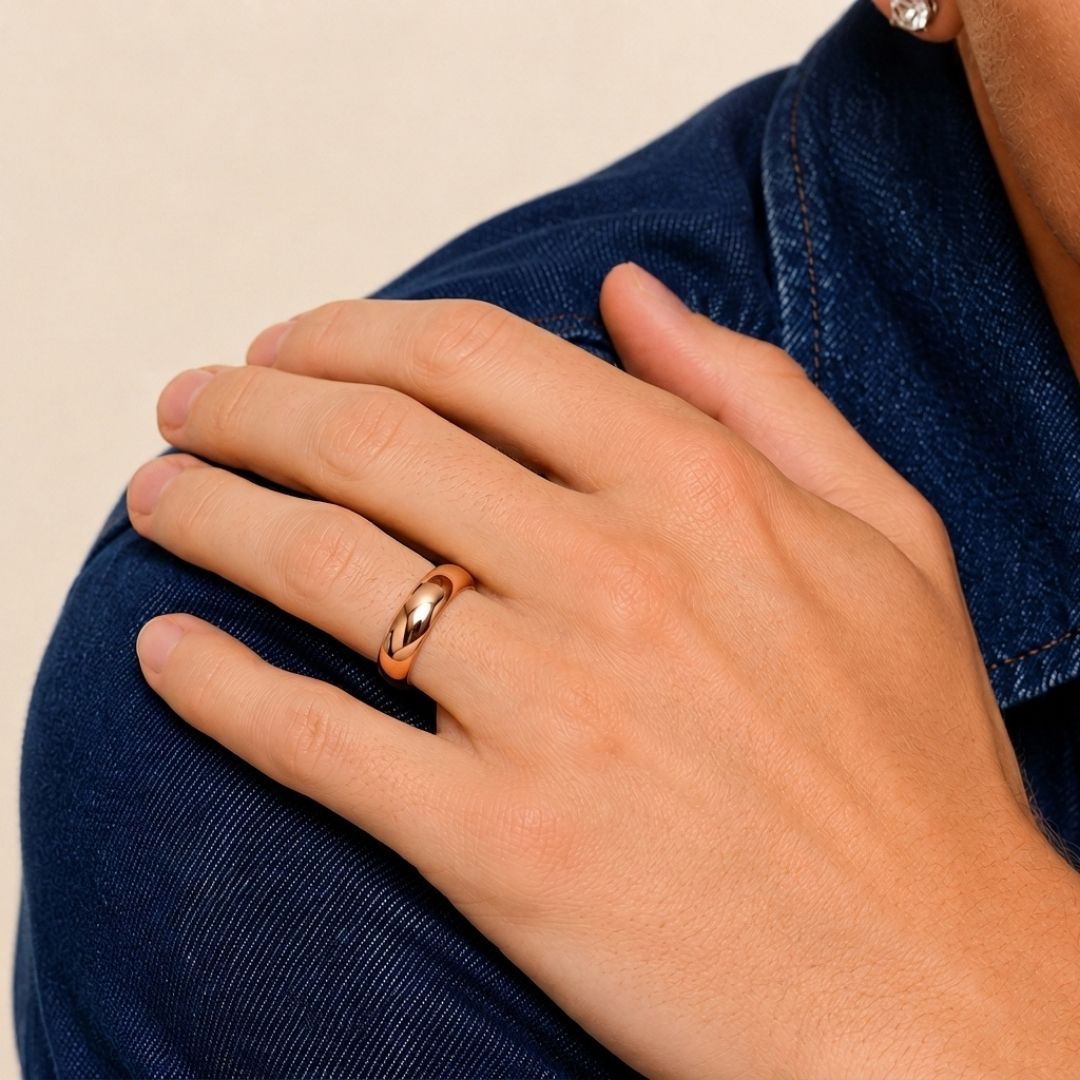 A model wearing the 6mm Slim Half Round Wedding Band in Rose Gold