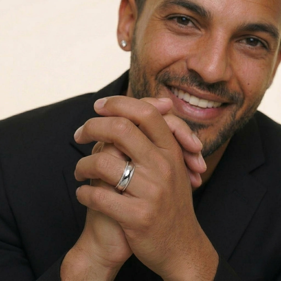 A model wearing the 6mm Sterling Silver Comfort Fit Milgrain Wedding Band