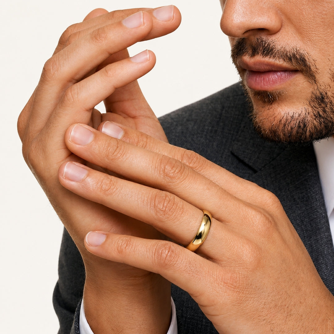 A model wearing the 7mm Slim Half Round Wedding Band in Yellow Gold