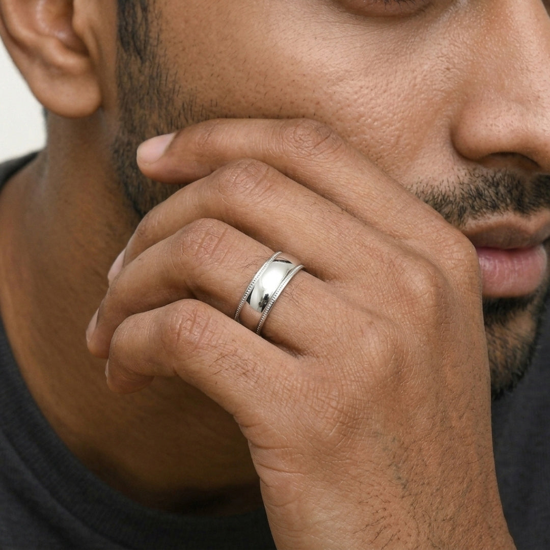 A model wearing the 8mm Sterling Silver Comfort Fit Milgrain Wedding Band