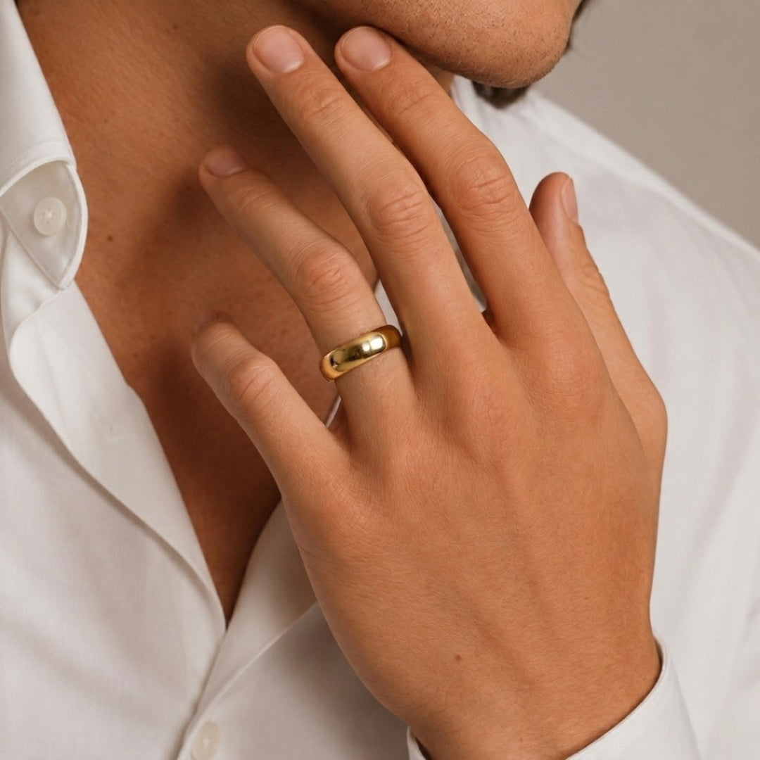 A model wearing the 8mm Slim Half Round Wedding Band in Yellow Gold