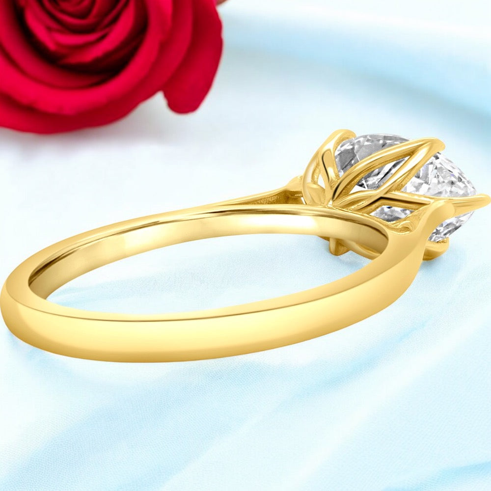 An image showing an alternate view of the Marquise Floral Engagement ring, showing the floral pattern in the head