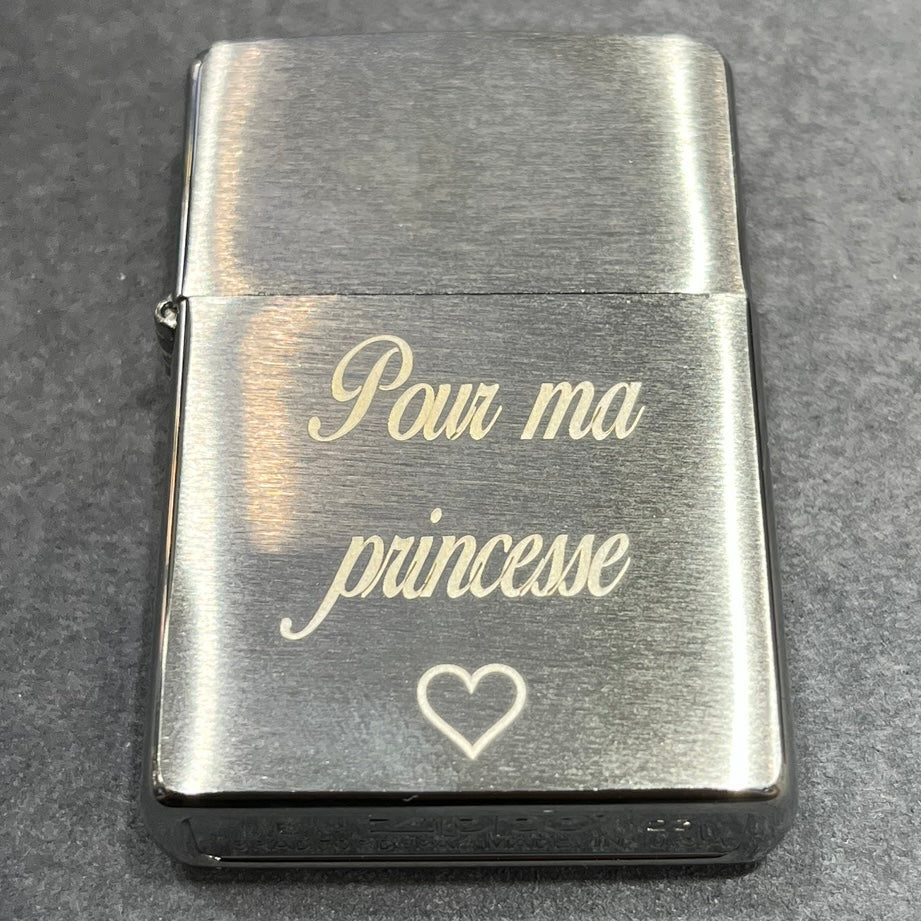 A picture showing an engraved lighter