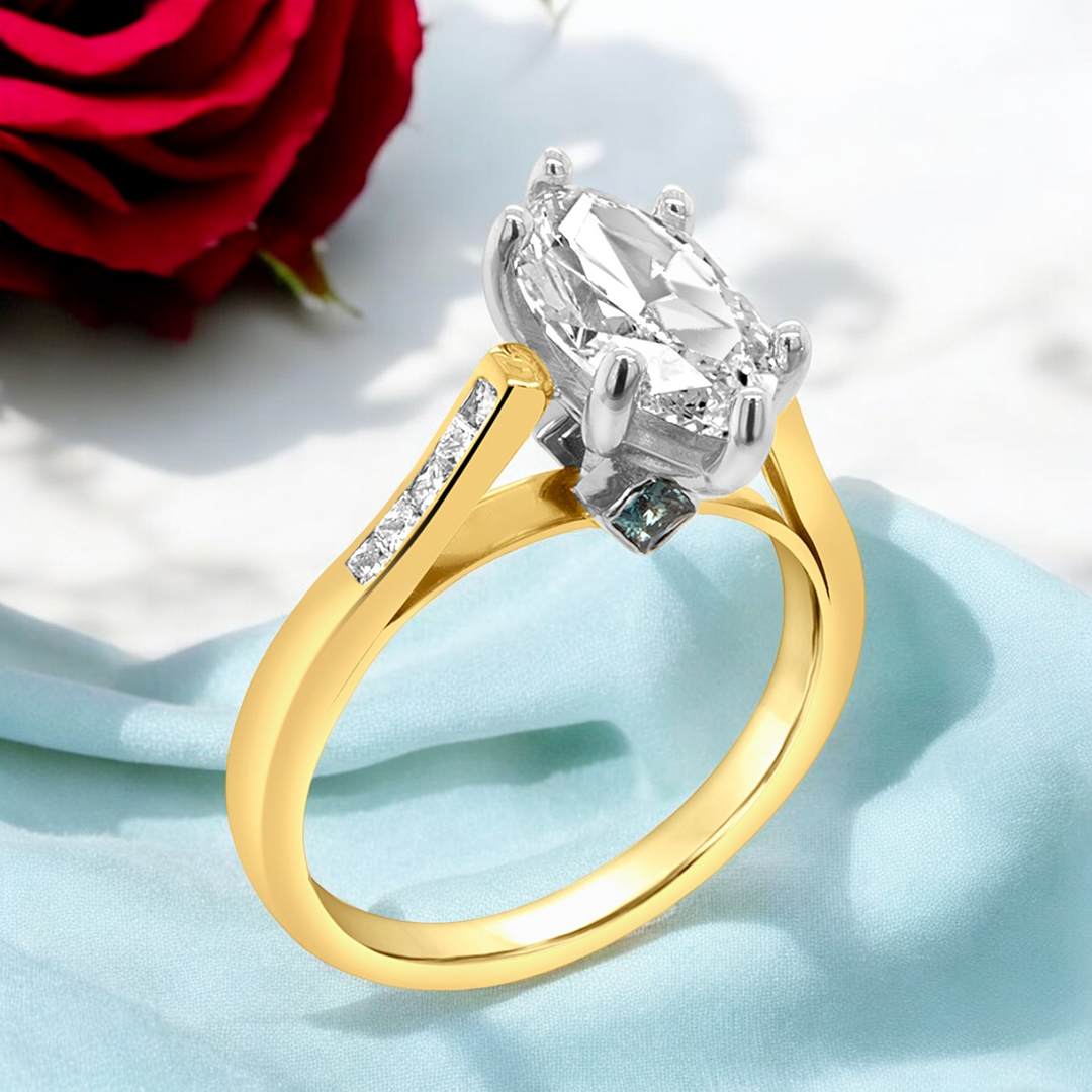 A image showing a angled view of the final presentation of the 14 Karat Two-Tone Lab Grown Marquise Engagement Ring