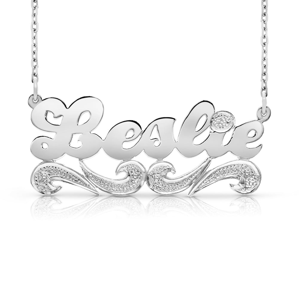 A Sample of the 14 Karat Script Name Necklace with Tail with the name Leslie in White