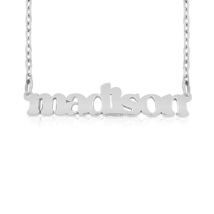 A sample of the nameplate with the name Madison in White Gold