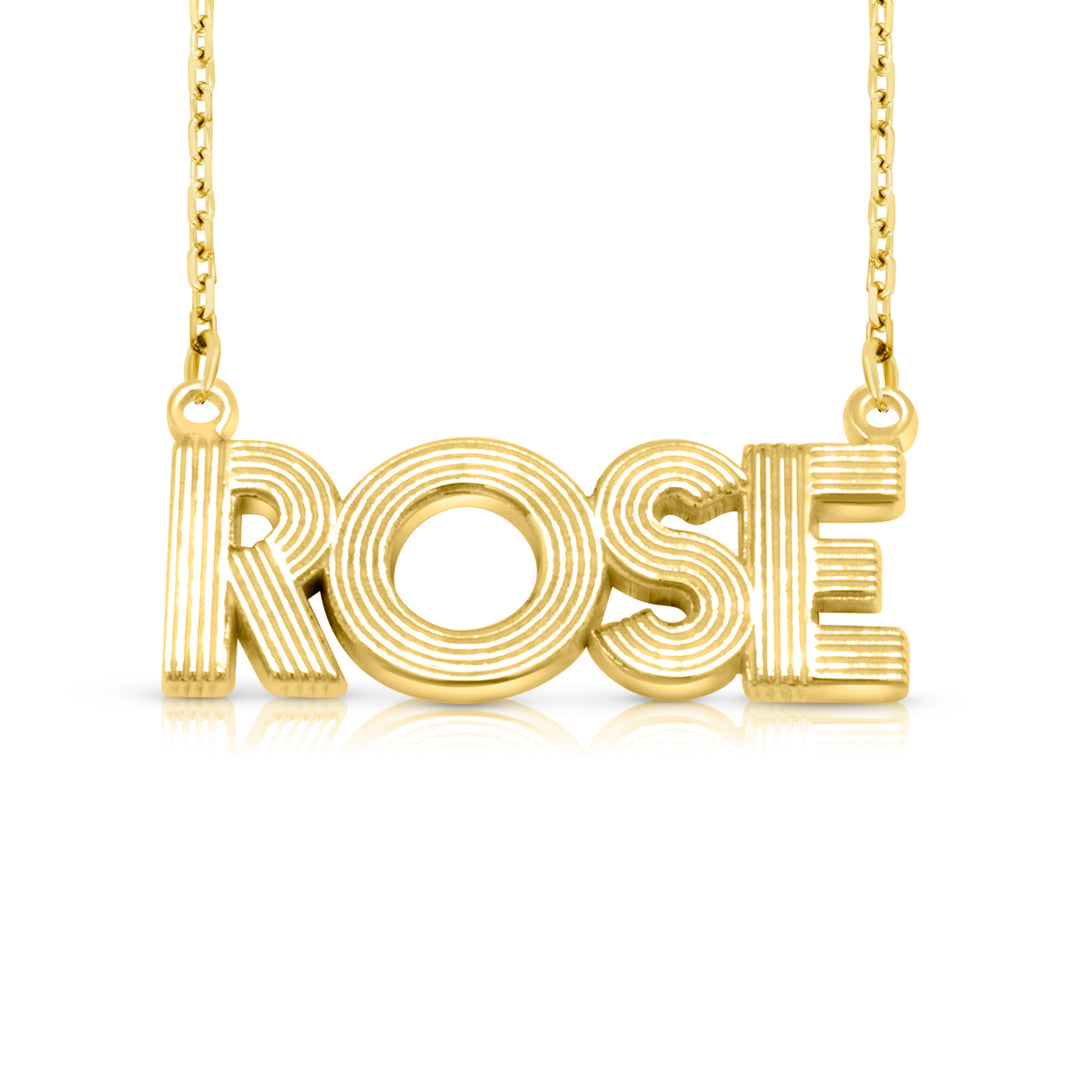 A sample of the nameplate with the name Rose in Yellow Gold