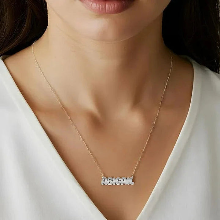 Model wearing the Sterling Silver Bubble Letter Name Necklace personalized with the name Abigail | AJ's Jewelry