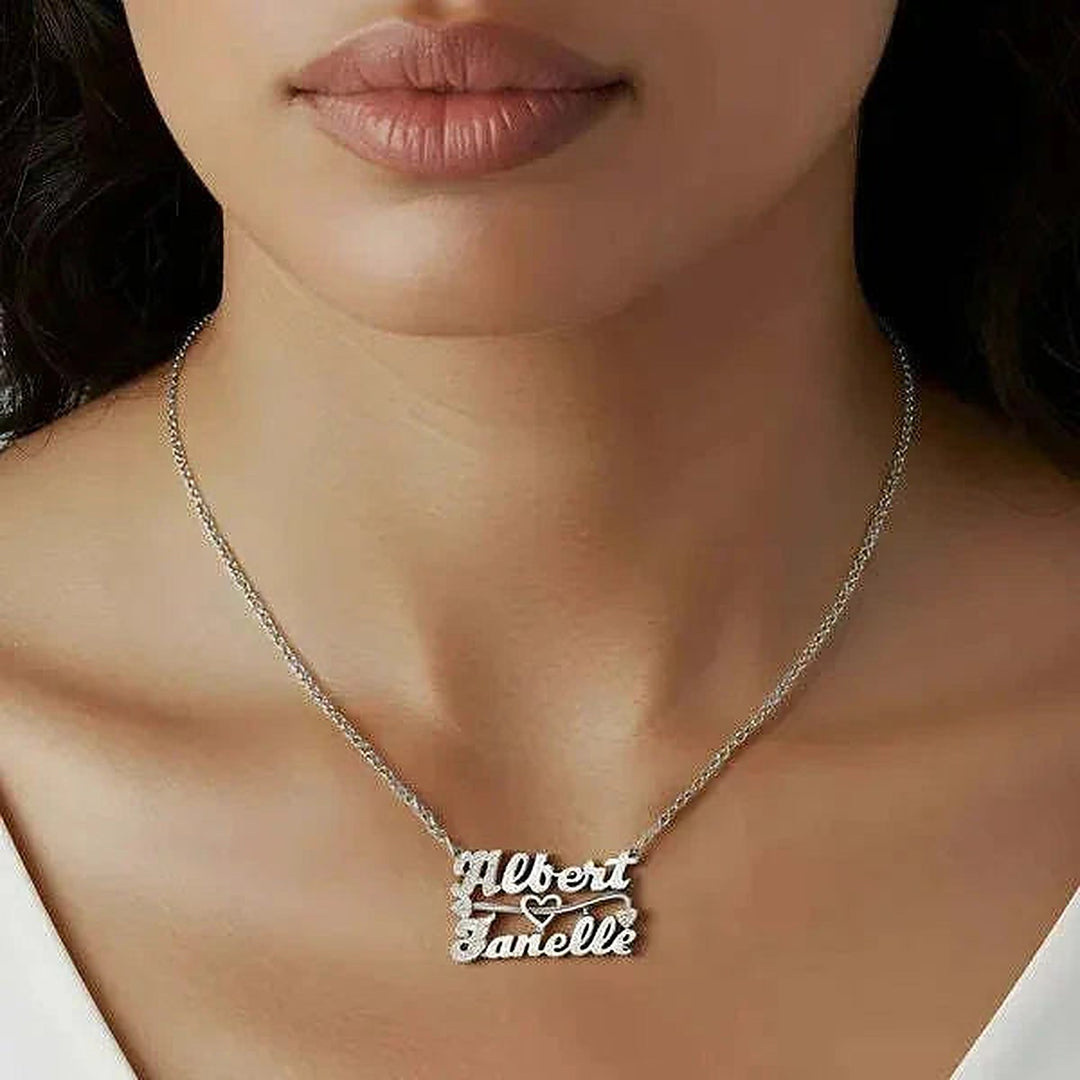 Model wearing the 14 Karat Two Name 3D Name Necklace in 14K white gold personalized with the name Albert | AJ's Jewelry